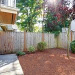 what color fence makes garden look bigger